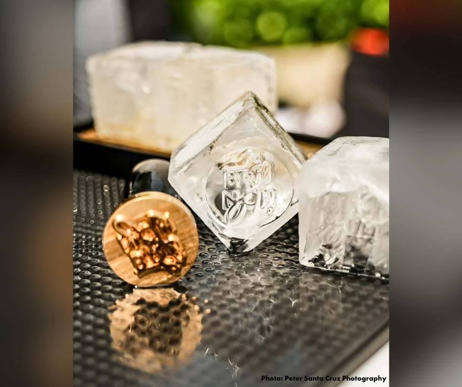 A closeup photo of custom gourmet ice cubes on a bar counter.